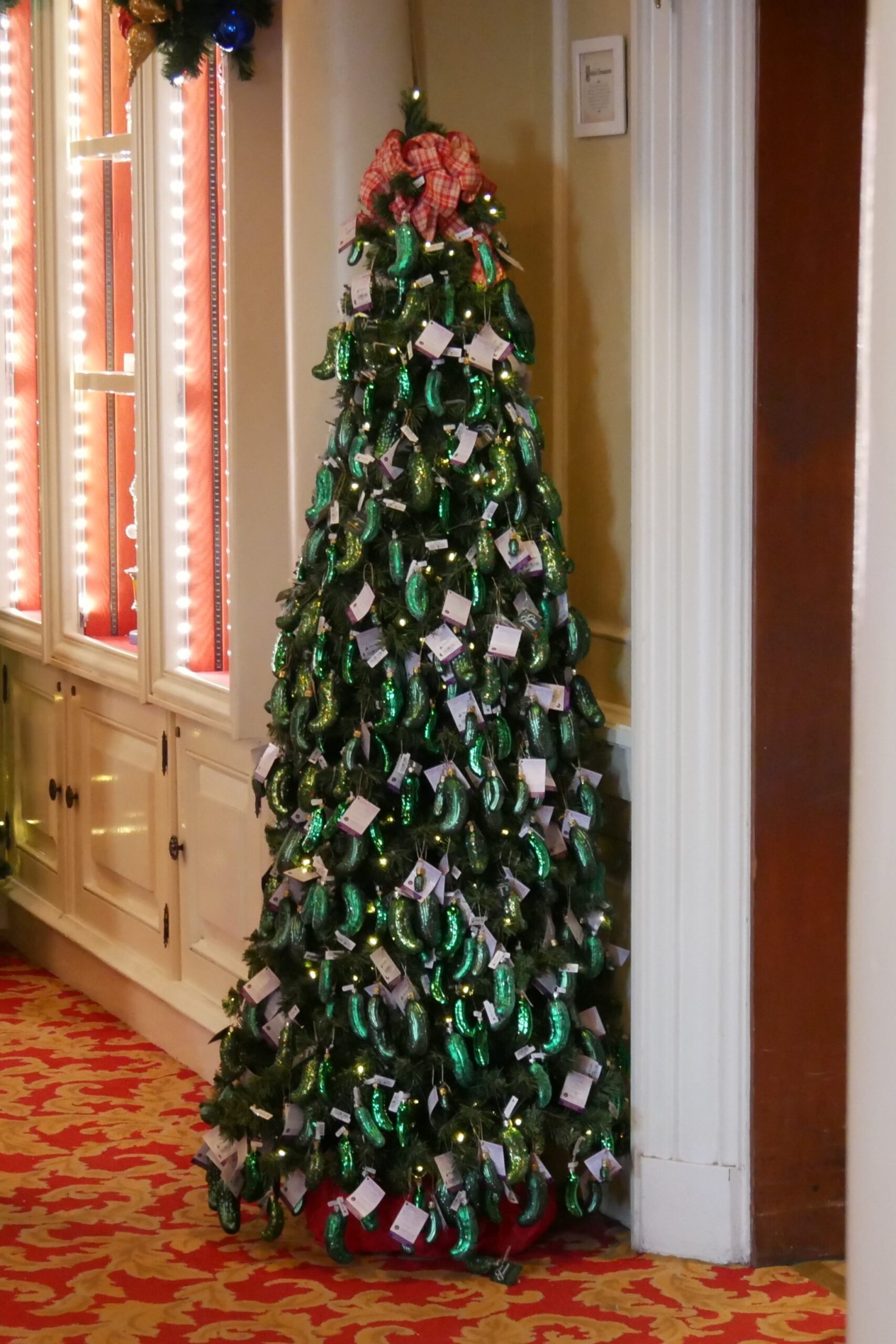 Tree decorated entirely in pickle ornaments