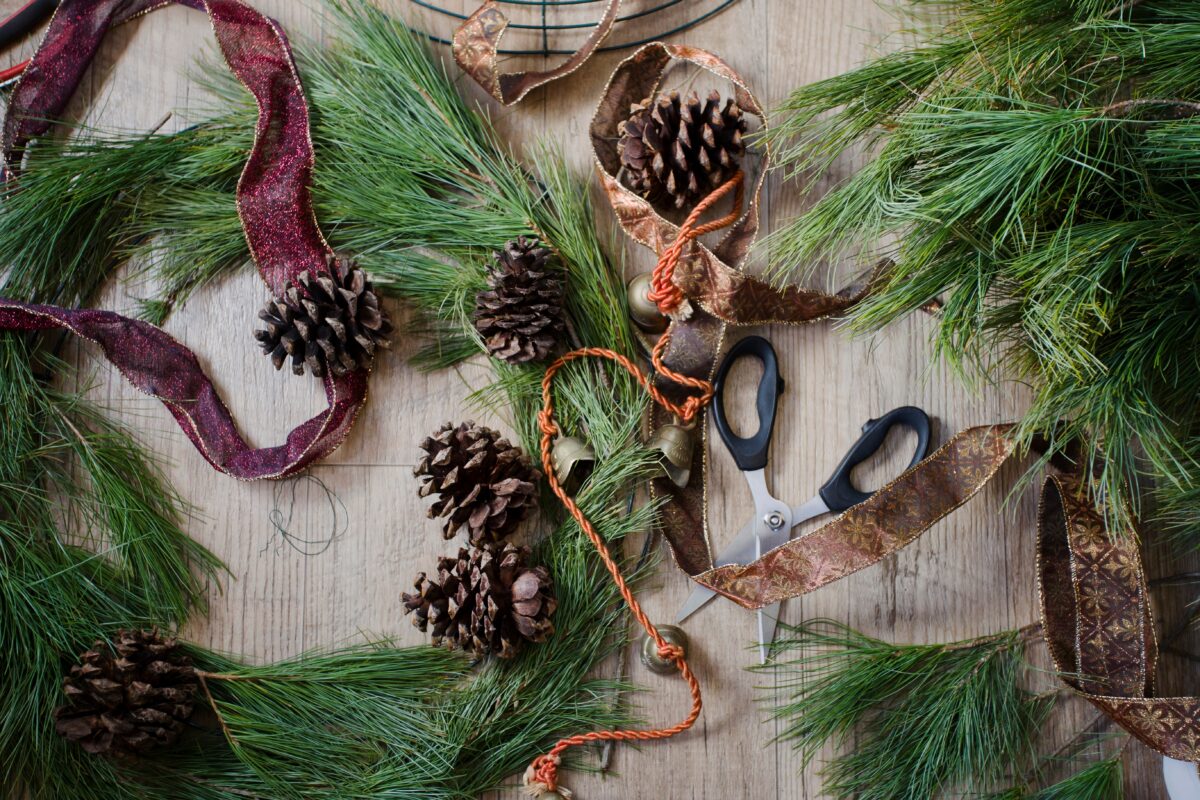 pine cones, evergreen garland and ribbon