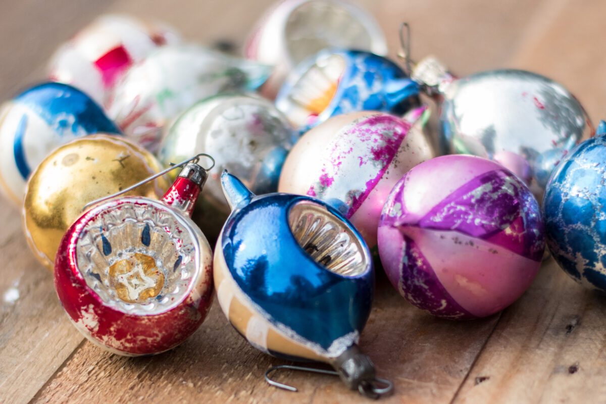 Vintage Christmas ornaments on wood table