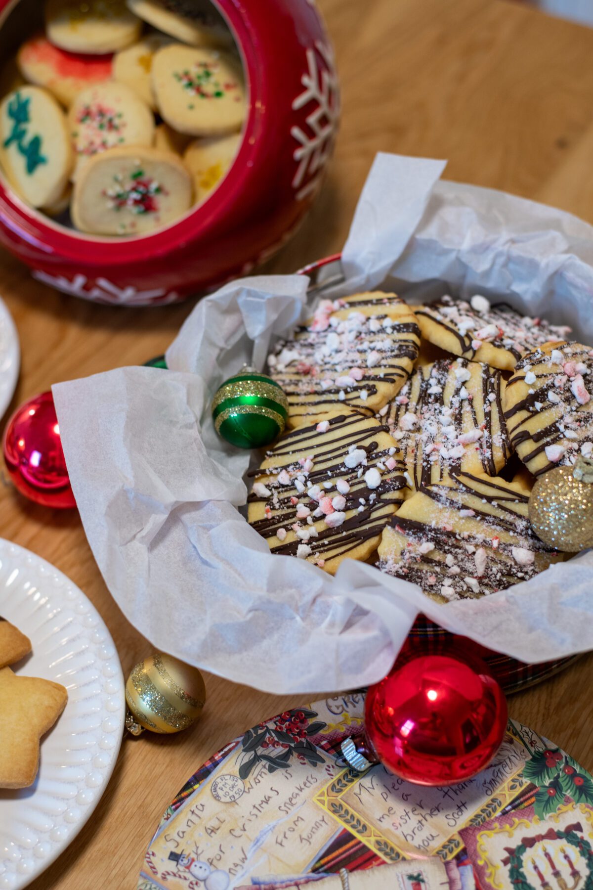 Shortbread cookies drizzled with chocolate and sprinkled with crushed peppermints