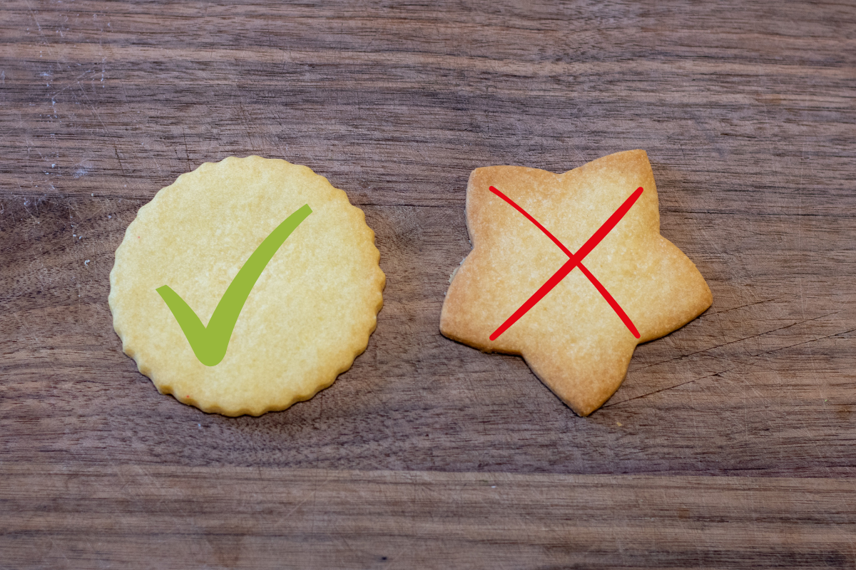 Two shortbread cookies, one is over cooked