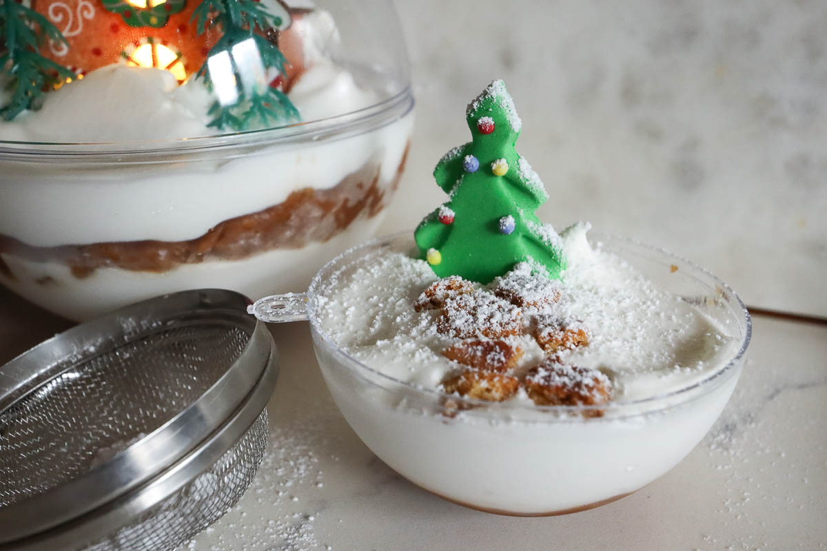 snow globe dessert with confectioners sugar