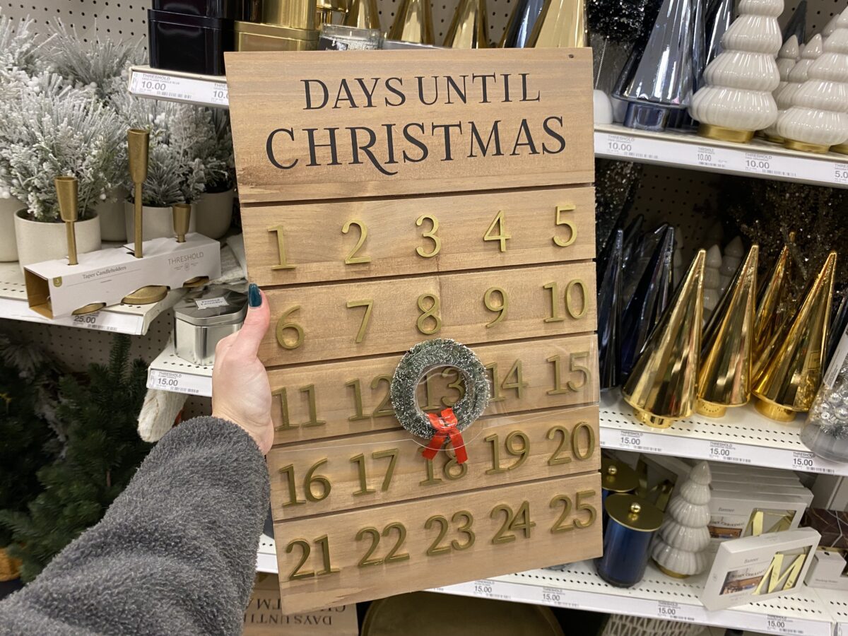 Woman's hand holding an advent calendar