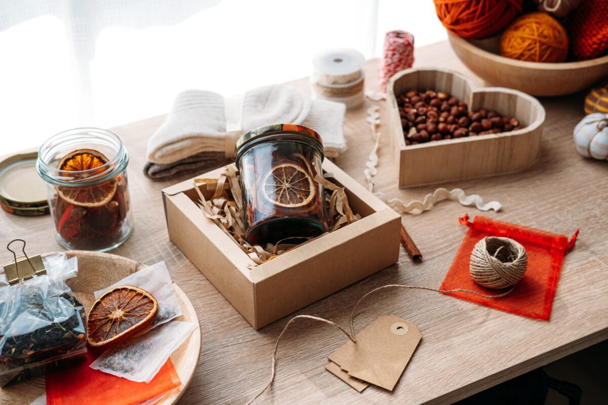 Jar of homemade potpourri with ingredients