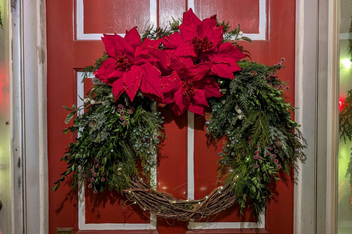 Wreath lit up with lights at night