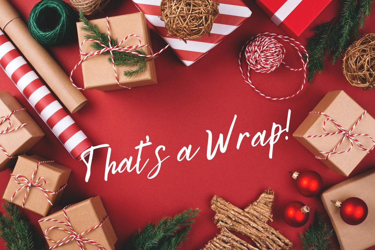 Presents and wrapping paper with text that reads, "That's a Wrap!"
