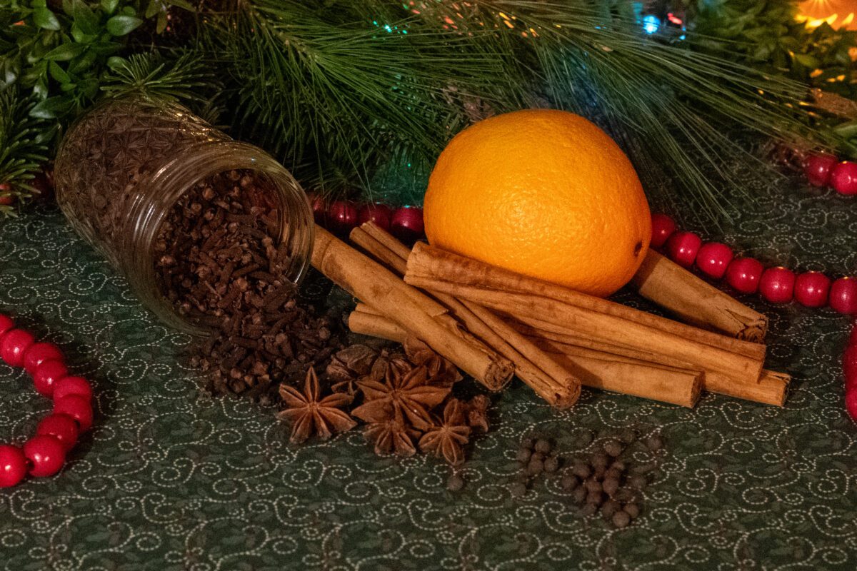 Spices and an orange to make Christmas syrup